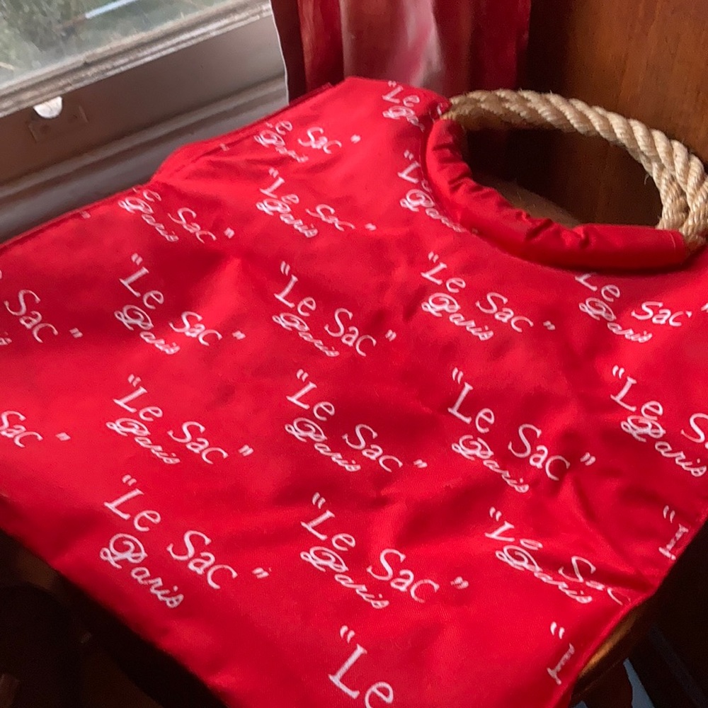 Red canvas tote bag. Never used.  Measures 14” x14” x 4-1/2”.